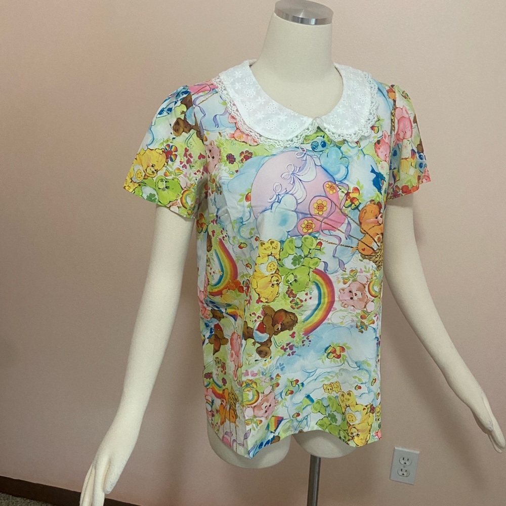 Dolls Kill Multicolor Cartoon Print Top with White Lace Collar